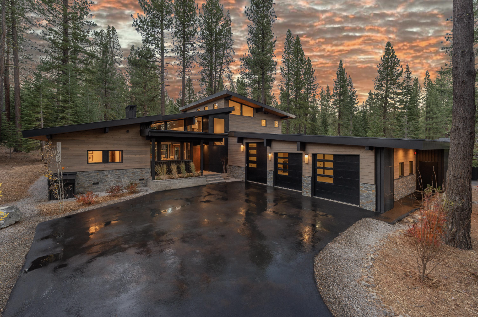 Modern custom mountain home at dusk in North Lake Tahoe
